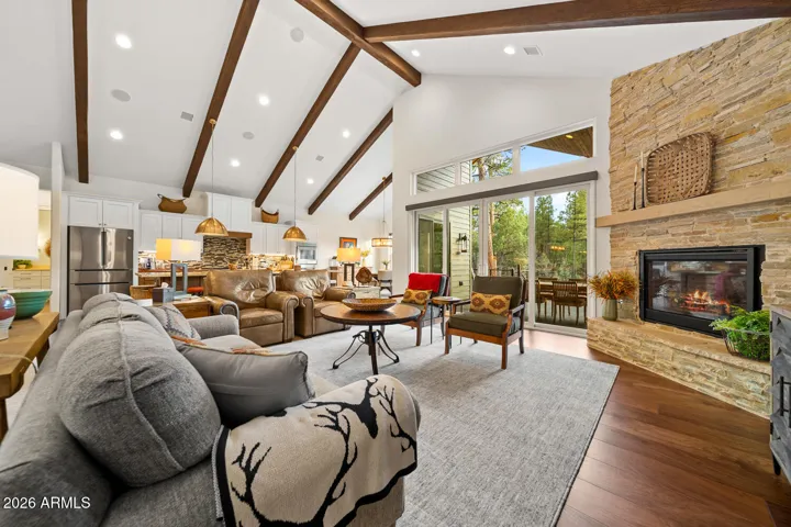 Open floor plan with spectacular windows & fireplace.