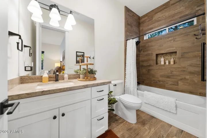 Guest suite 2 bathroom with tub-shower combination.