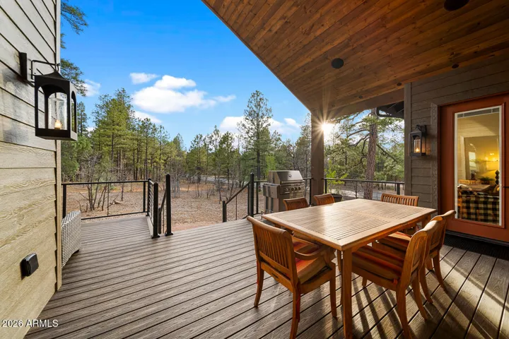 Vaulted, covered back deck with exits from the dining room, great room & guest suite
