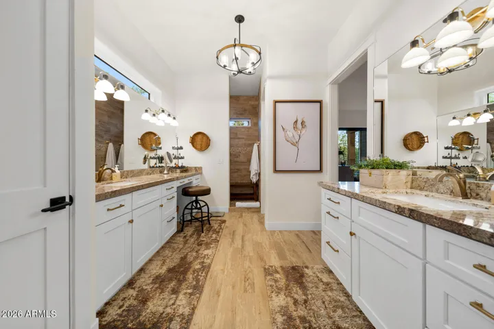 2 impressive vanities in master suite with lots of storage.