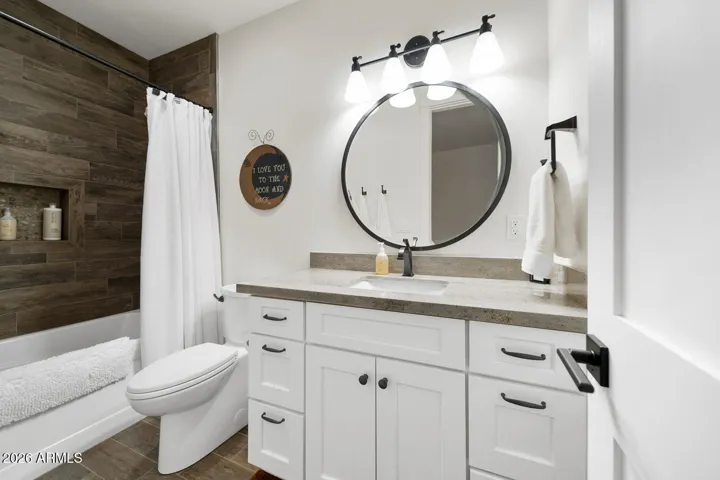 Full bathroom with tub/shower combo in bonus room