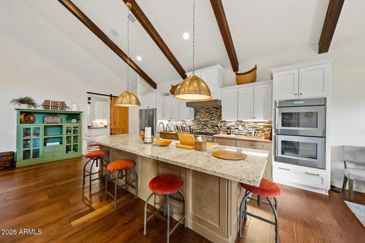 Double ovens with side-open doors & large butler pantry off kitchen.
