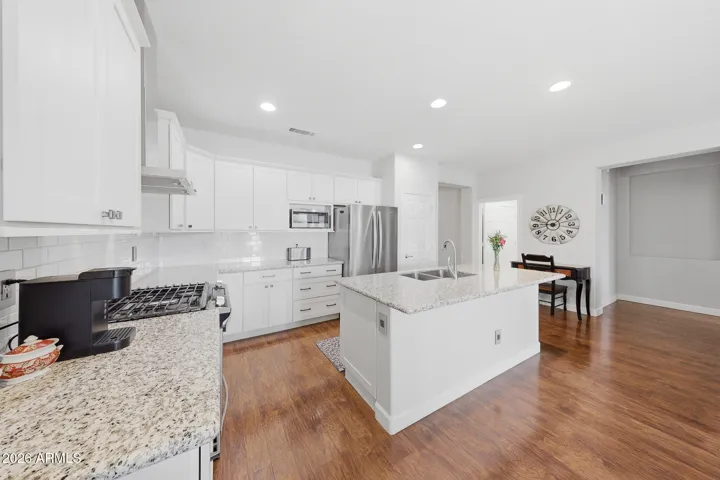 White cabs, subway tile backsplash & granite counters