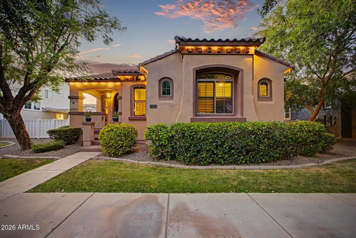 The inviting front porch, lush, mature landscaping, and undeniable curb appeal set a warm, memorable tone.