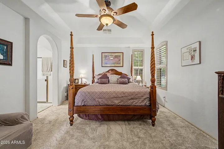 The owner’s suite is a private sanctuary, offering an ensuite bathroom with dual vanities, a luxurious jetted tub, a spacious walk-in shower, and a generous walk-in closet.