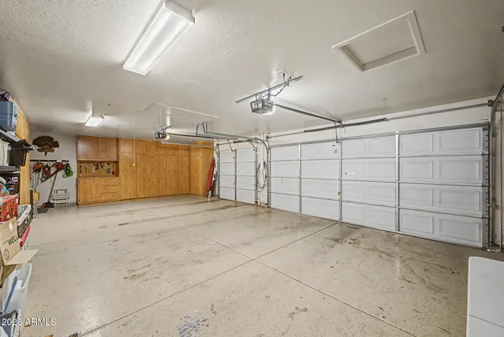 Detached, extended garage accommodates three vehicles and provides abundant attic and cabinetry storage for ultimate convenience.