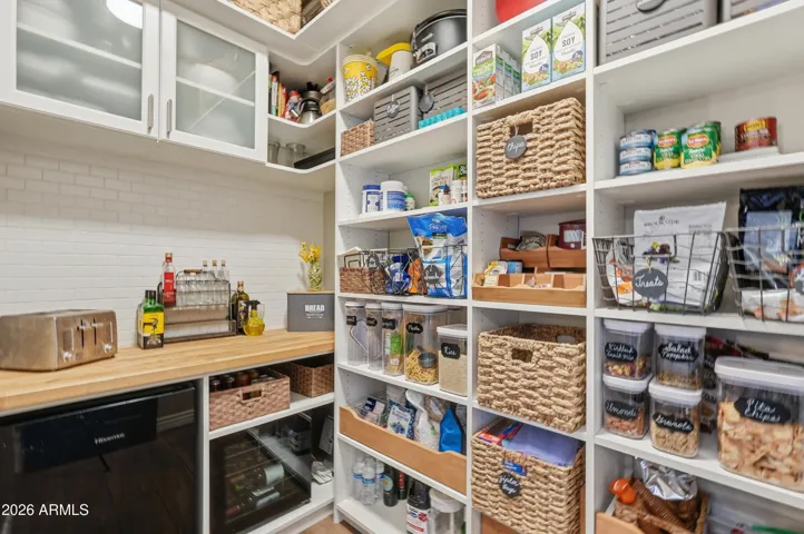 Custom built-ins and additional counter space & mini fridge area