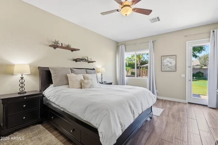 Spacious primary suite offers backyard access