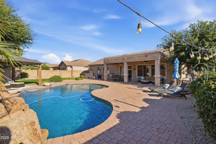 Covered patio, extended paver patio w/ multiple seating areas,
