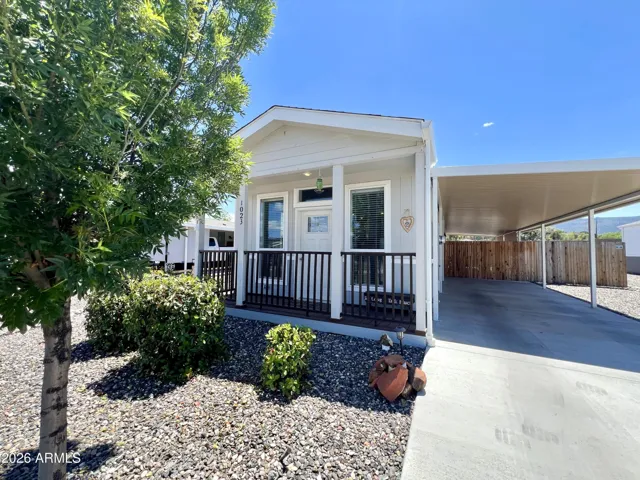 Front exterior with carport