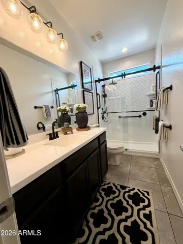 Stylishly updated secondary bath with refreshed shower