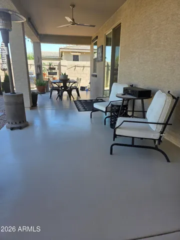 Extended covered patio spanning the full length of the home