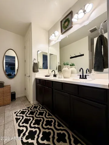 Primary bathroom includes a double sink vanity