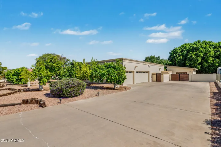 Extra long & wide driveway, 3 car side entry, extended length garage.