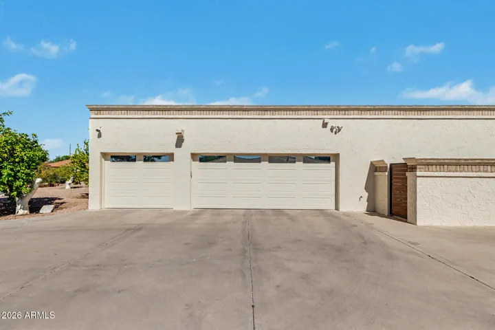 3 car, extended length, side entry garage with extra long & wide driveway for additional parking.