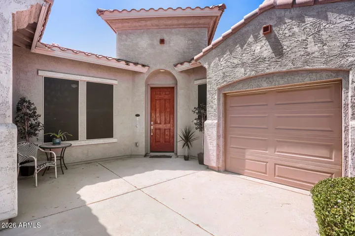 Inviting courtyard entry adds warmth and character to the home’s welcoming design.