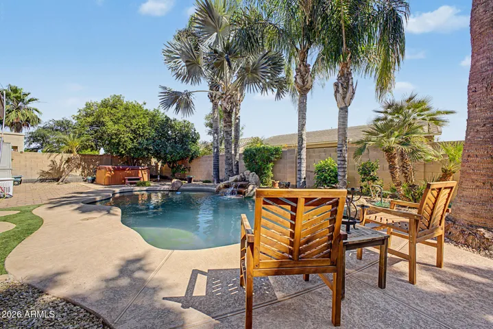 Backyard oasis with beautiful play pool and rock waterfall
