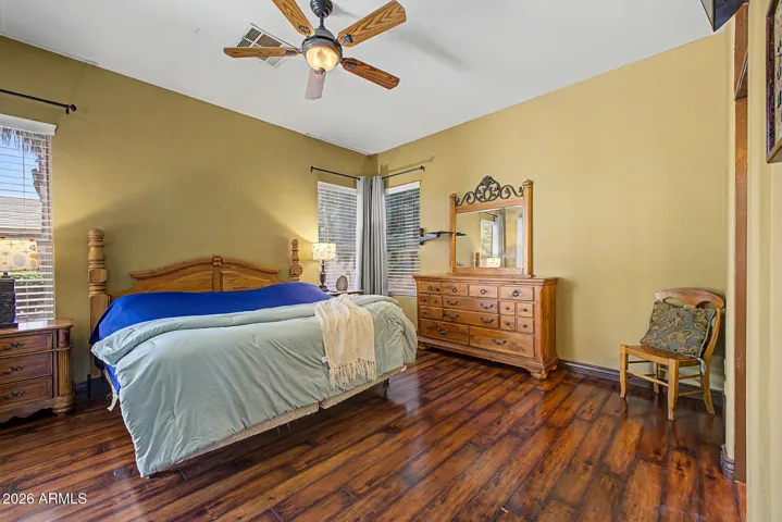 Primary Bedroom with sliding glass door to the backyard oasis
