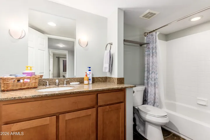 "Fresh and fully stocked — granite vanity, tub/shower combo, and toiletries provided for your arrival."