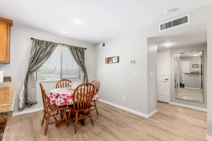 "Light-filled dining area with easy flow to the rest of the condo — airy, practical, and welcoming for extended stays."