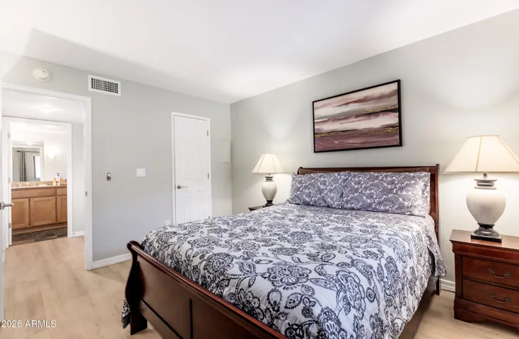 The master bedroom connects directly to a private en-suite bath and walk-in closet — everything you need, steps away.