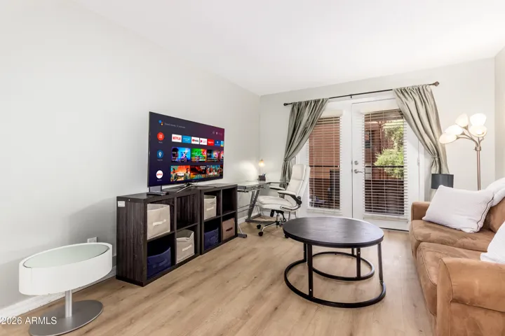 "Room to breathe — generous living space with smart TV, work corner, sofa, and direct balcony access. Feels like home from day one."