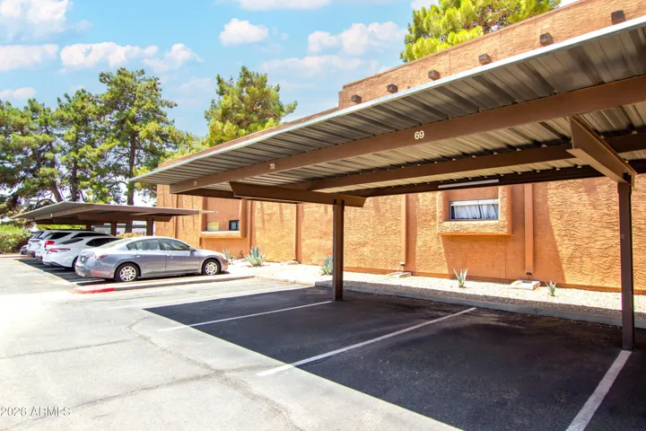 "Your dedicated covered parking spot is included — numbered, shaded, and protected from the Arizona sun. No extra charge, no hunting for spots."