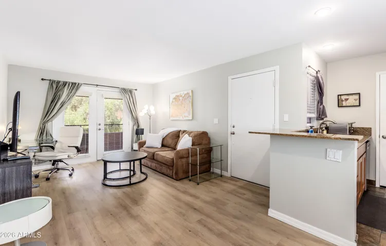 "Bright, open, and move-in ready — spacious living area flows seamlessly into the kitchen bar. Everything in one comfortable space."