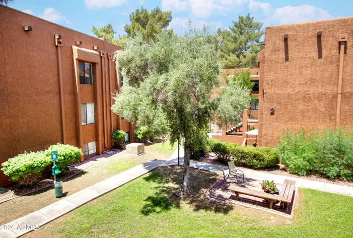 "Relax in the courtyard — your peaceful outdoor retreat right outside the door."