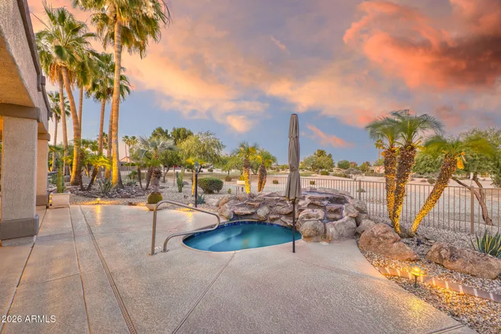 Looking to the northeast, the view is spectacular with the trees and golf course landscaping highlighted by the pink and peach hues.