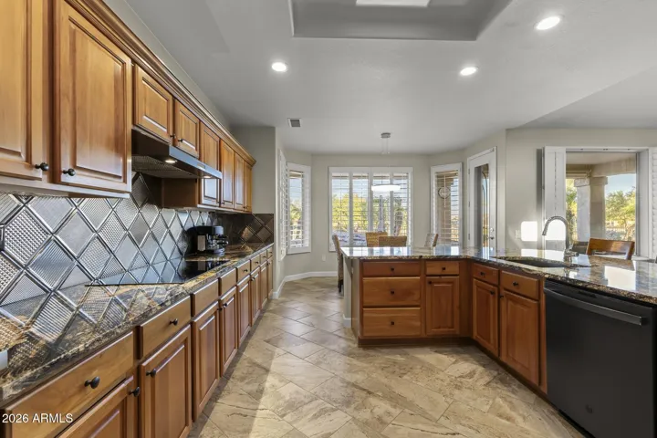 There's plenty of light with the recessed lighting, and tons of natural light with all of the windows and a designer skylight in the center.