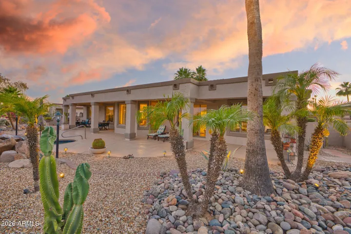 Where the property line meets golf course, the back of the house is stunning.