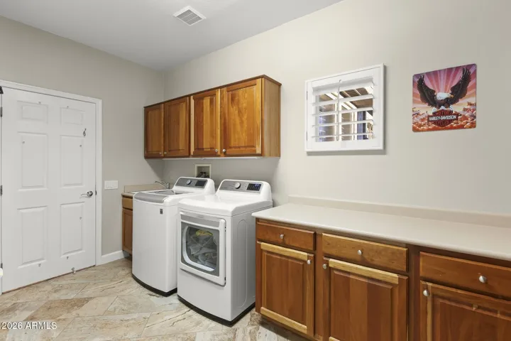 Aside from the new washer and dryer, there is a built in ironing center (not pictured).