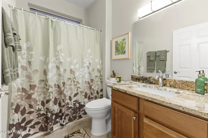 The guest ensuite has granite tops, undermount sink, new toilet, shower/tub.