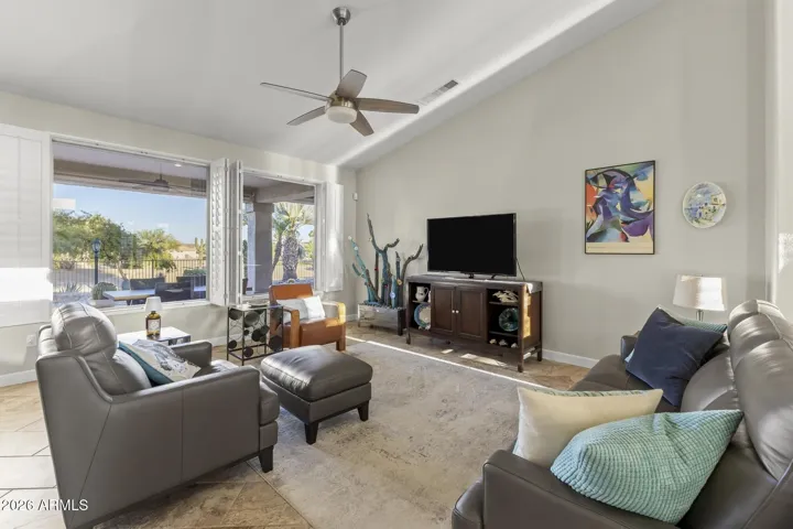 Straight ahead is the spacious great room designed for style and comfort with large windows fir a view of the golf course.