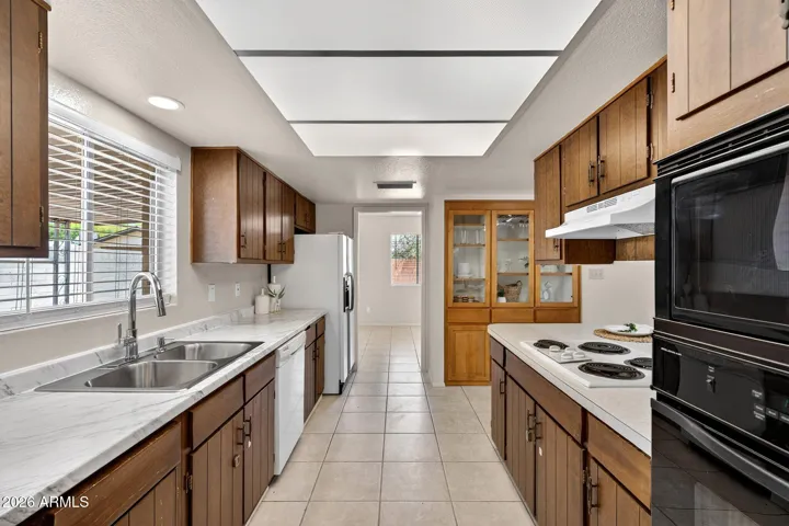 Updates include a new laminate counter and new faucet. Built in microwave and oven.