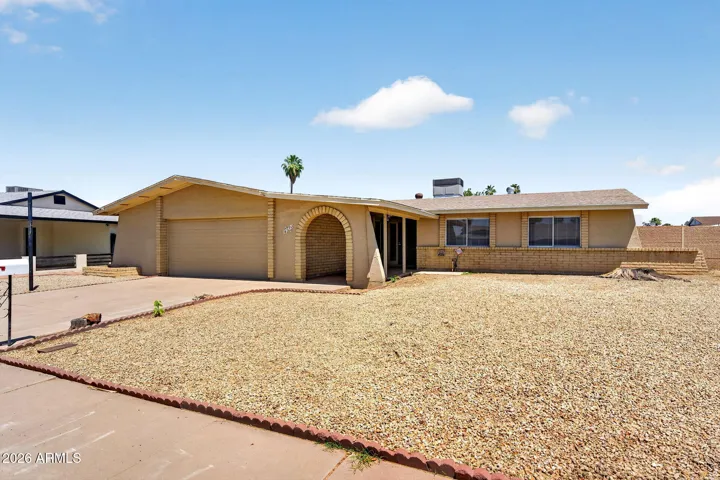 Blank canvas in the front yard. Simply rocks, waiting for your special touch.