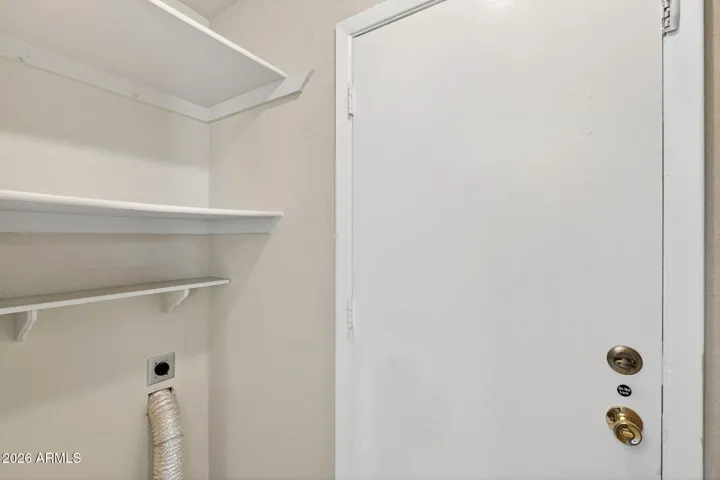 Inside laundry with 220V electric dryer and washer hookups