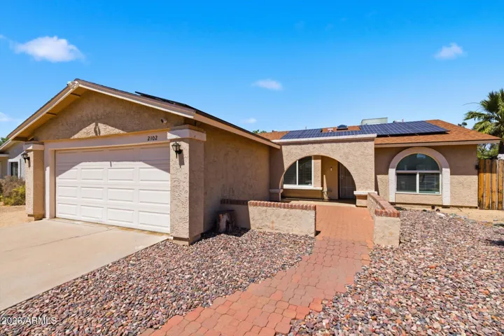 The archway entry provides not only architectural interest but also privacy for your courtyard patio!