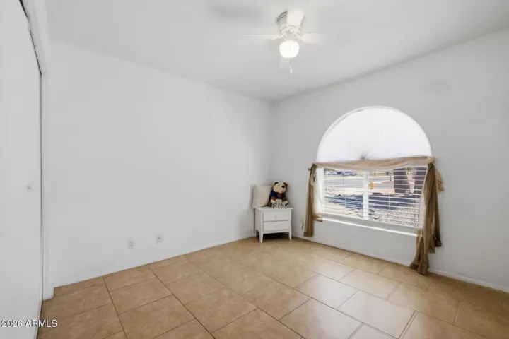 The split floor plan offers privacy with two of the bedrooms and one bath on one side. Full length closet offers plenty of storage and the half moon window brings in lots of light!