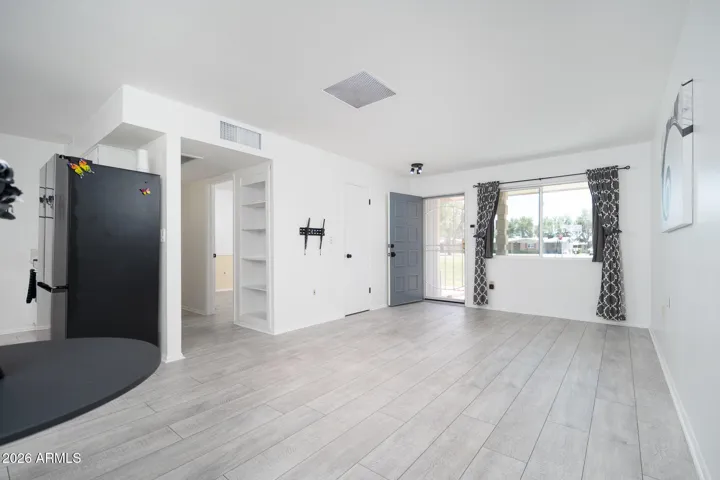 OPEN CONCEPT FLOOR PLAN, WALL TO WALL VINYL PLANK FLOORING.