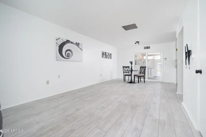 SPACIOUS GREAT ROOM WITH SKYLIGHT.