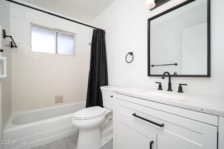 HALL BATH WITH UPDATED VANITY.