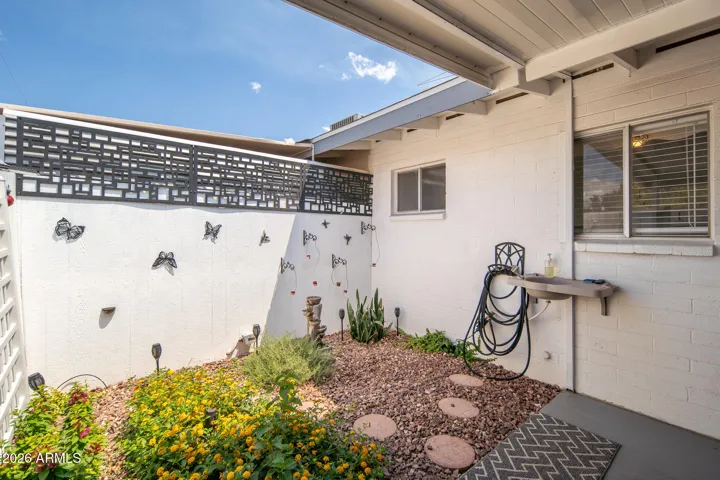 LANDSCAPED, PRIVATE GARDEN, WITH WATER FEATURE.