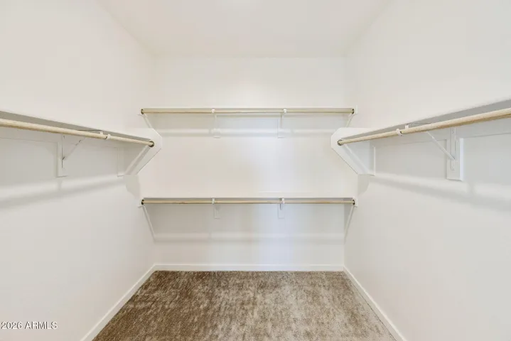 OWNER'S BATH HAS DUAL VANITIES, HIS AND HER CLOSETS, SEPARATE TUB AND SHOWER AND LOTS OF STORAGE!