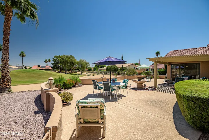 Like the rest of the home, the patio is impressive with its size and detail. Knee wall with lights and wraps around to the side of the home also.