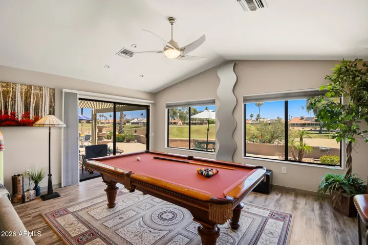 Game section of great room with golf-course views