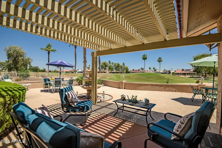 Daytime view of golf course from patio. Overhead cover just a couple of years old.