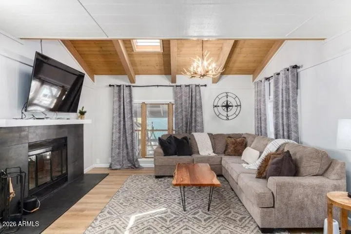 Living room with wood burning fireplace.