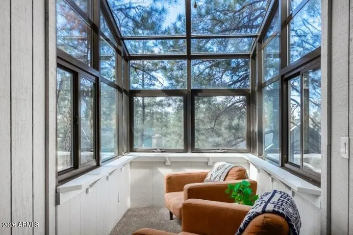 Upstairs viewing glass room connected to bedroom.